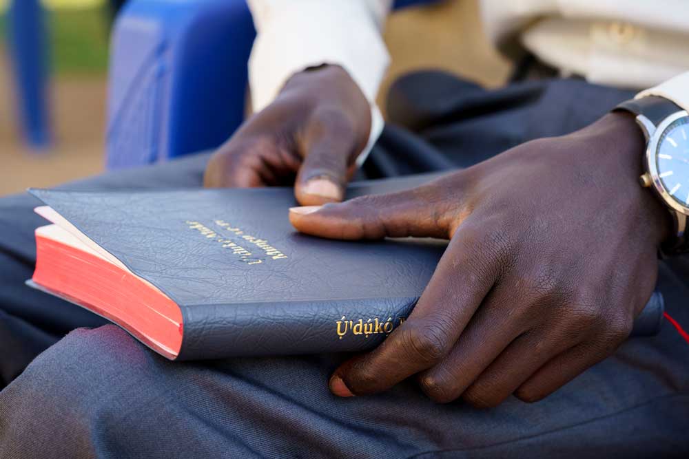 Man holds a new Bible